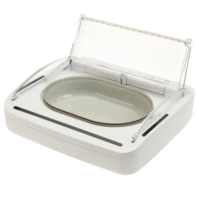 White automatic pet food dispenser with clear lid and oval bowl for cats or dogs